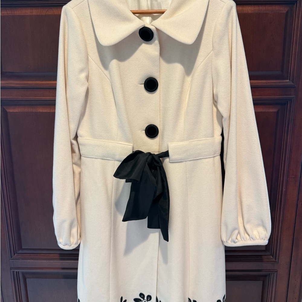 Elegant Cream Coat with Black Accents